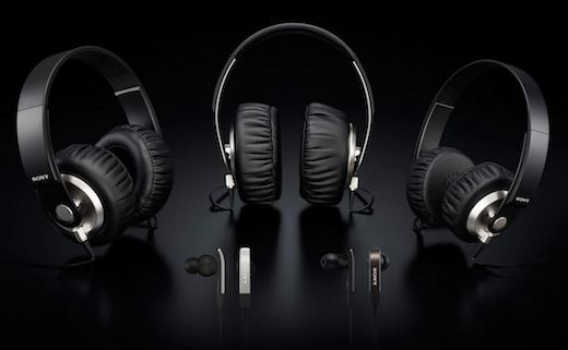 3 pairs of headphones on black background